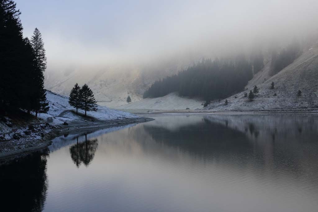 Seealpsee in winter - clear water and mist Seealpsee in winter - clear water and mist